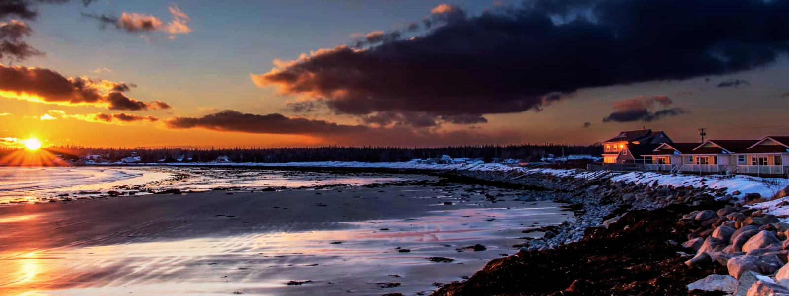 Oceanfront cottage on the Nova Scotia coast at dusk